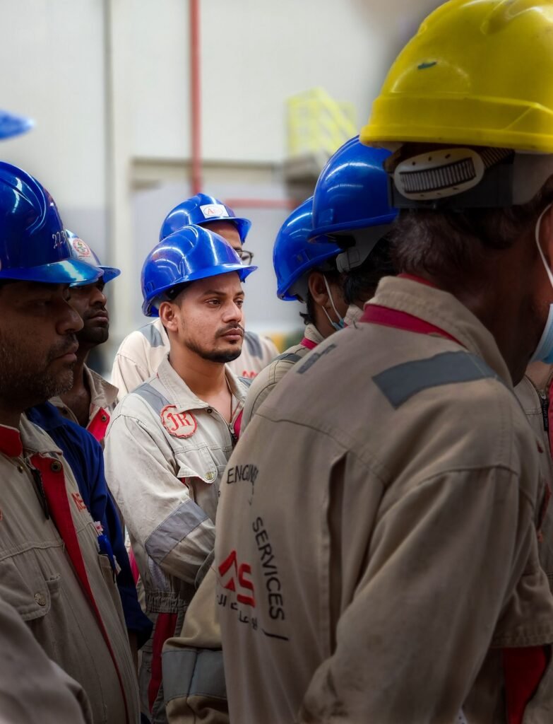 Site workers in safety helmets on a project in Doha, Qatar