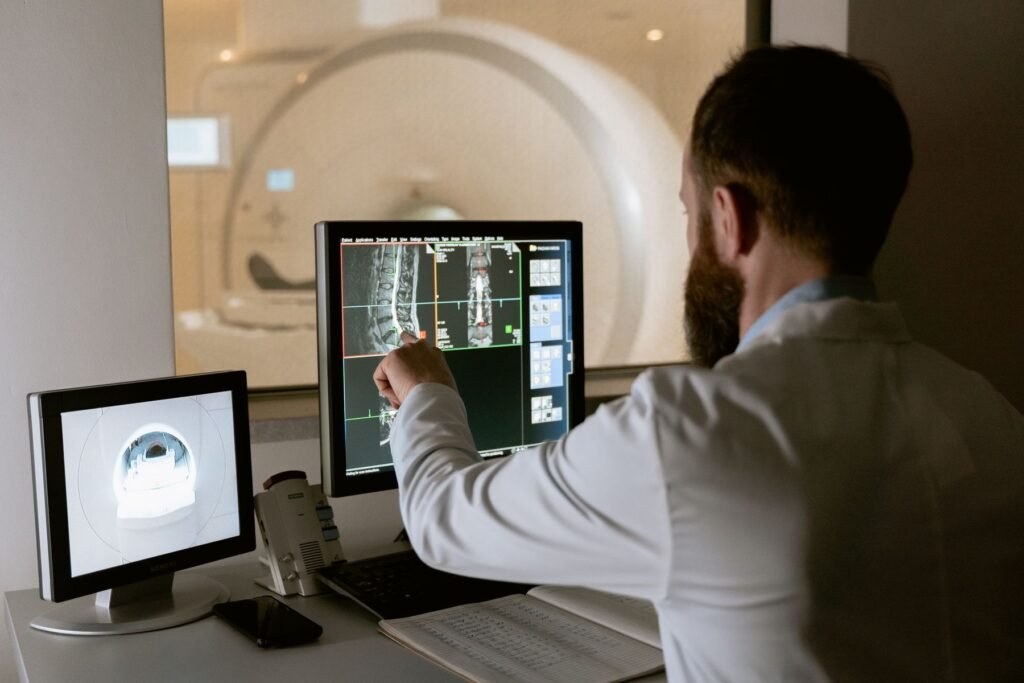 Clinician reviewing diagnostic images at an imaging control console